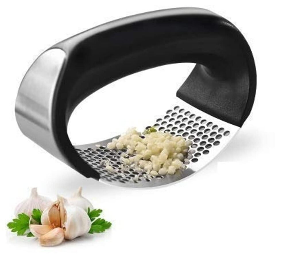Stainless steel garlic press and crusher with ergonomic handle, designed for mincing fresh garlic cloves quickly and efficiently.