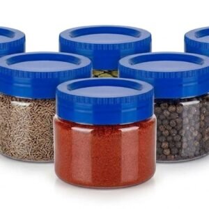 Clear spice storage jars with blue lids filled with assorted spices
