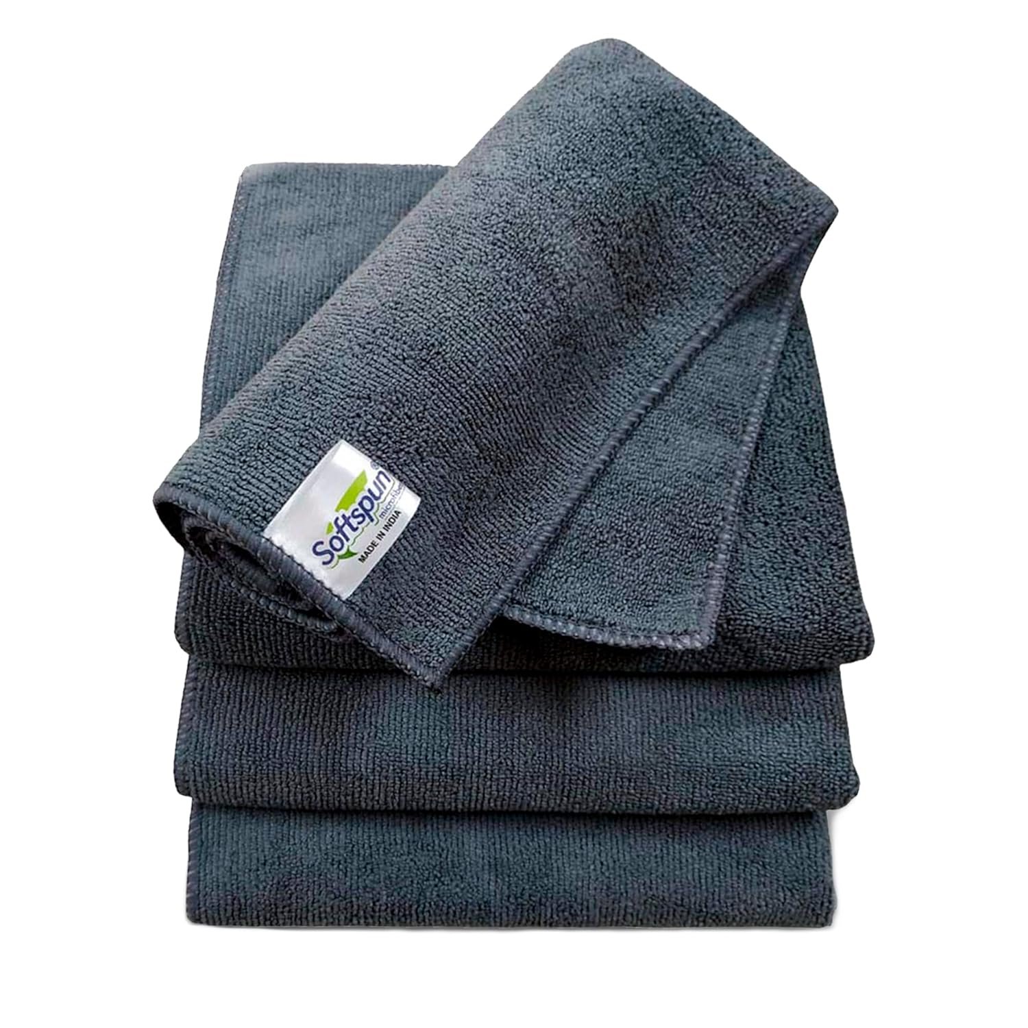 Softspun dark grey bath towels stacked together, featuring a soft textured fabric and compact folded design for everyday bathroom use.