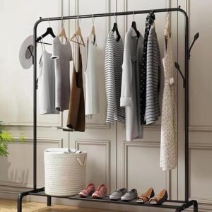 Modern clothing rack with hanging clothes, shoes and storage basket