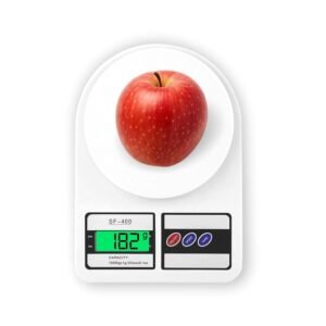 Digital kitchen weighing scale measuring an apple in grams